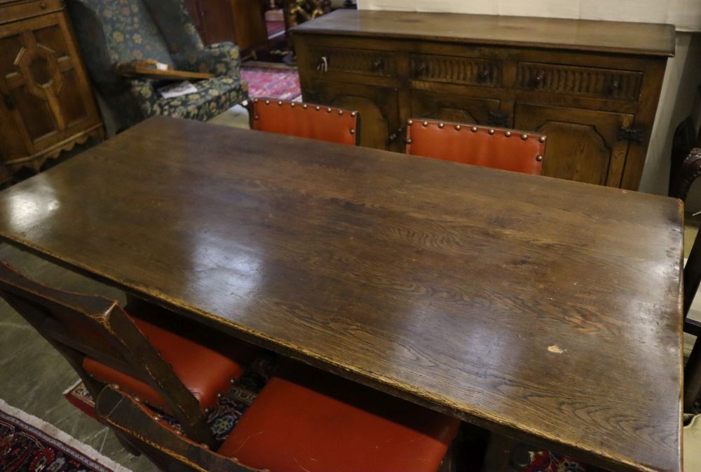 An 18th century-style oak refectory dining table, sideboard and four chairs, table 182 x 79cm height 76cm
